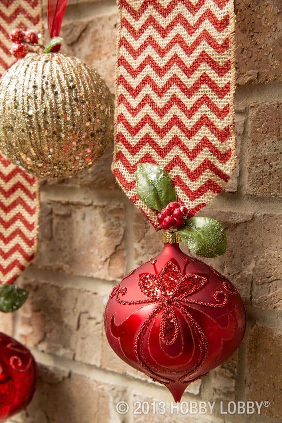 Easy DIY hanging mantel ornaments using burlap. Elegant Christmas decoration idea for mantle, window, ceiling, or wall. Great budget decor idea for the home, winter wedding, or Christmas party. Dollar store.