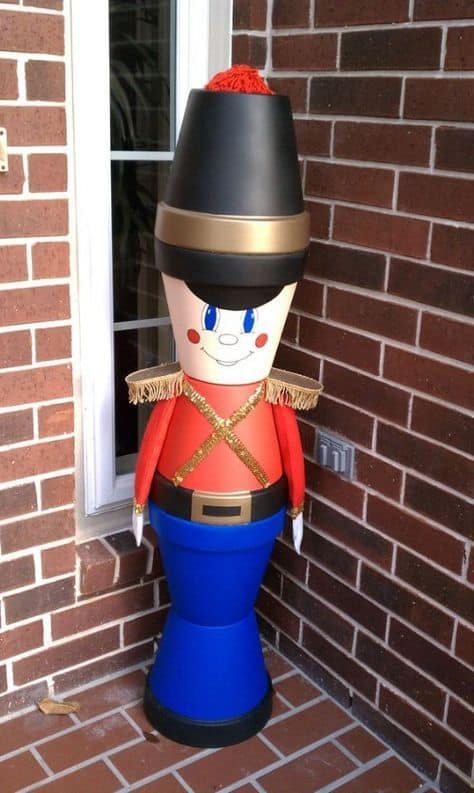 How to make: Easy DIY Clay Pot NutCracker Christmas Decorations using claypots. Perfect Christmas or winter decoration for indoors or out doors. Great Budget decor ideas for the home. #Christmas #Craft