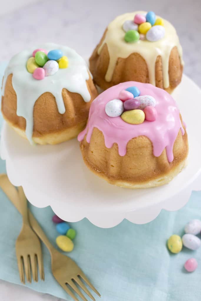 Easy and Elegant Mini Easter Bundt Cakes for kids using candy eggs. Simple Easter cake decorating ideas and dessert recipes.