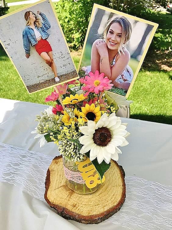 Glue photos to stock paper and sticks and insert into a Rustic Graduation Party centerpiece. Easy DIY Graduation Party Decoration Ideas using Pictures.