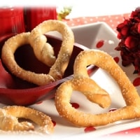 Easy DIY Heart Shaped Pretzels made out of Dinner Roll dough for Valentines Day Dinner and snacks. DIY boyfriend gifts.