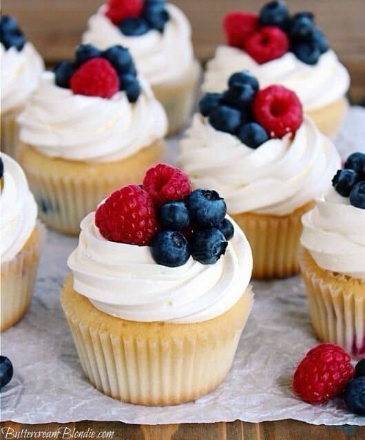  Red White and Blue Vanilla Cupcakes decorated with fruit. Easy DIY 4th of July Party ideas. #Patriotic