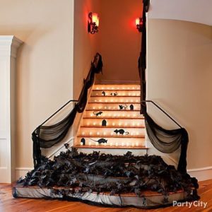 The Best and Easiest Halloween Party Decorations That Will Keep Guests Out of the bedrooms and in the party zone using Lights, Cheese Cloth, and Rodents or leaves. Great Dollar store decoration ideas.