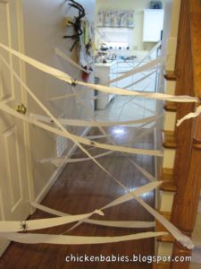 The Best easy Halloween Party Decorations That Will Keep Guests Out Using Crepe Paper or Cob Webs and Spiders. Great dollar store idea.