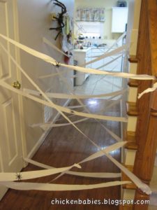 The Best easy Halloween Party Decorations That Will Keep Guests Out Using Crepe Paper or Cob Webs and Spiders. Great dollar store idea.