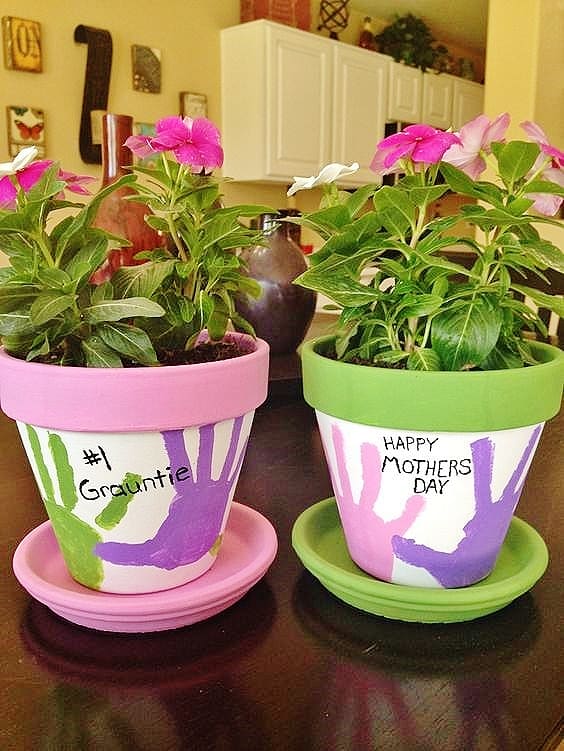 Easy DIY Hand Print Flower Pot Kids can make for Mothers Day. A great last minute gift idea.