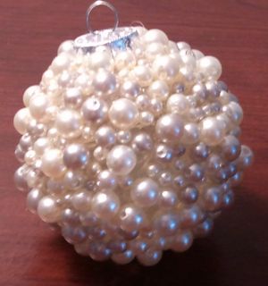 Easy DIY Pearl Christmas Ornament That Looks Store Bought. Just use an old ornament, glue gun, and pearls or beads.