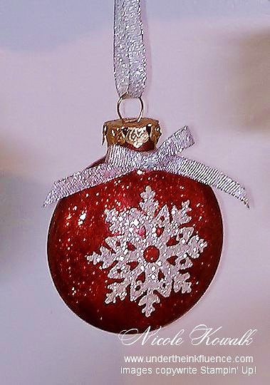 Easy DIY Glitter SnowFlake Christmas Ornament for Christmas Trees using a cricut, glitter paper, a clear glass ornament, and the glitter mop and glow method. This is perfect for, kids, Crafts, Christmas ornaments for an apartment, a friends gift, and teachers gift..