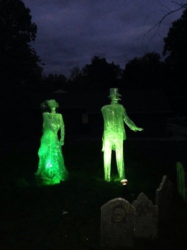 Lighted Ghosts made out of packing tape Halloween decor