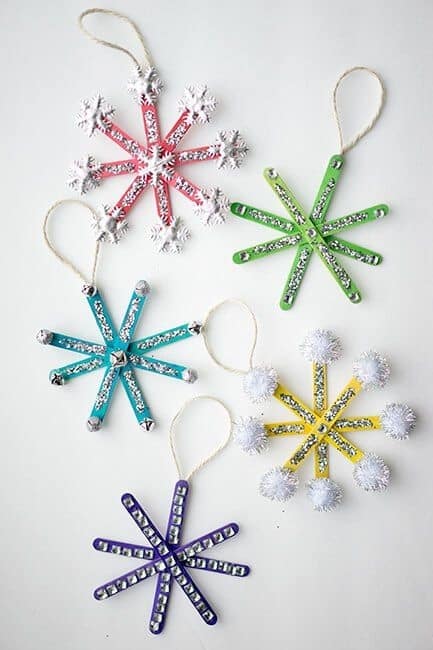 Easy DIY Glittering Popsicle Snowflake Ornament. Simple yet beautiful dollar store craft gift idea anyone can make, even kids,