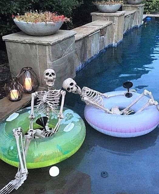 Skeletons floating in the pool