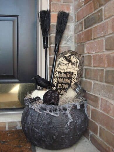 Halloween witches caulderon decor on porch