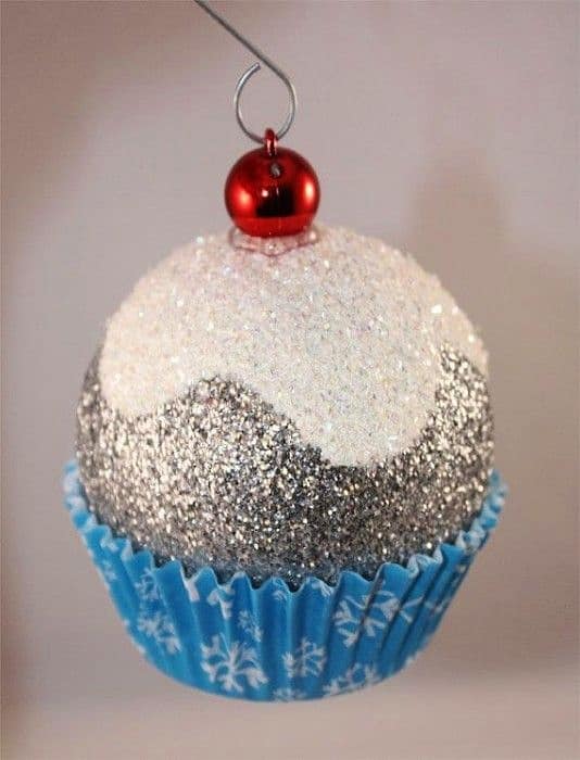 Easy DIY Cupcake Glitter Ornaments that look store bought. Made from regular ball ornaments, glue, cupcake liners, and glitter you'll actually want to keep these ornaments or give them as gifts. Great craft for Christmas.