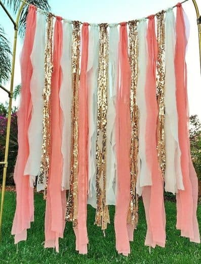 Easy DIY Graduation party decorations and picture ideas. Cheap and easy method for making a gorgeous photo backdrop or photo booth using dollar store crepe paper, streamers, or ribbon for both outdoor and indoor.