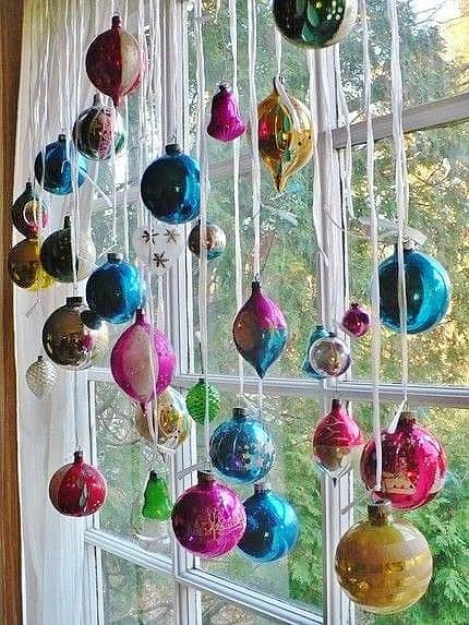 Easy DIY hanging window ornaments using ribbon. Elegant Christmas decoration idea for mantle, window, ceiling, or wall. Great budget decor idea for the home, winter wedding, or Christmas party.