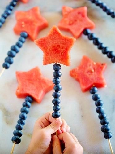 Easy DIY 4th of July Party ideas. Red White and Blue fruit skewers #Patriotic #4thofJuly