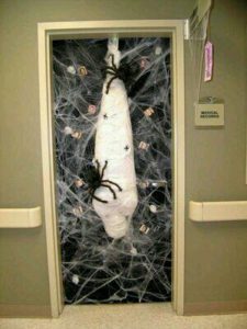 The Best Creative Halloween Decor that'll keep guests out using guaze , webs and spiders. Great dollar store idea.