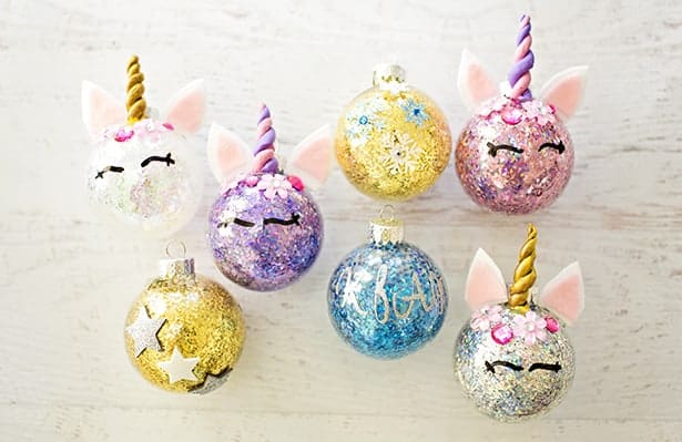 Easy DIY Unicorn Glitter Ornaments That Look Professional. They make great gifts and you can customize them with a name and date in the back. So adorable you'll want to keep these for yourself. Cricut projects.