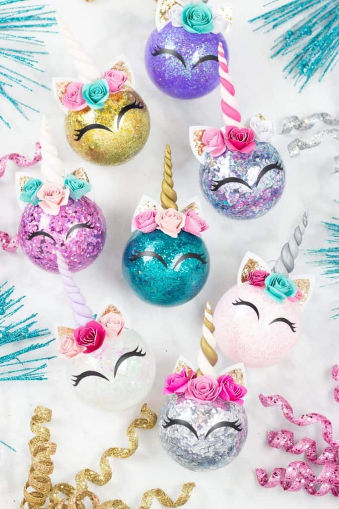 Easy DIY Unicorn Glitter Ornaments That Look Professional. They make great gifts and you can customize them with a name and date in the back. So adorable you'l actually want to keep them. Cricut projects, Cricut Christmas projects.